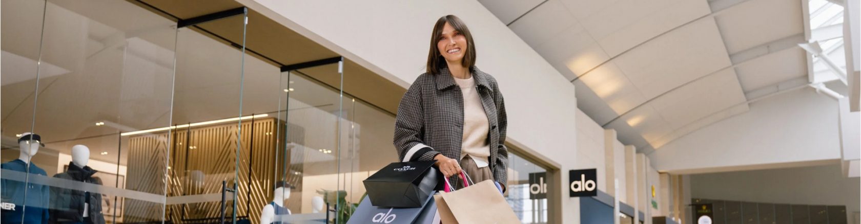 Woman enjoying a rewarding shopping trip with great value deals and exclusive in-store offers