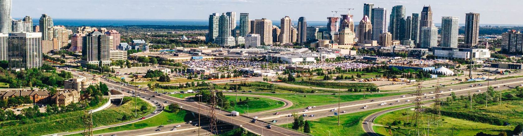 City skyline with a major roadway showing clear directions and easy access to the shopping centre