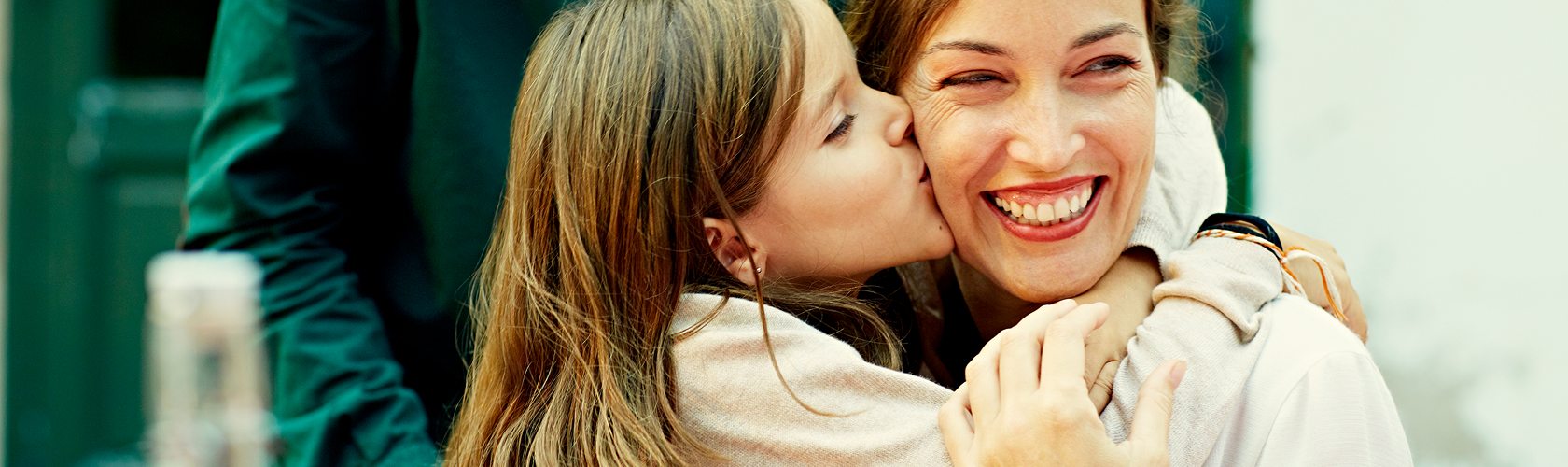 Mother and child sharing a joyful moment together during a gift card shopping experience