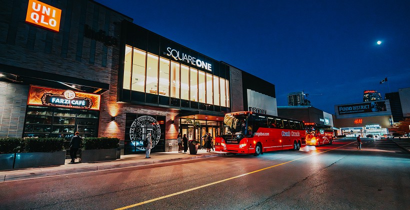 Group bus parked outside Square One Mall entrance for shopping visits and drop off area